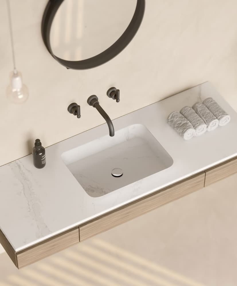 Meseta de baño en mármol con lavabo integrado